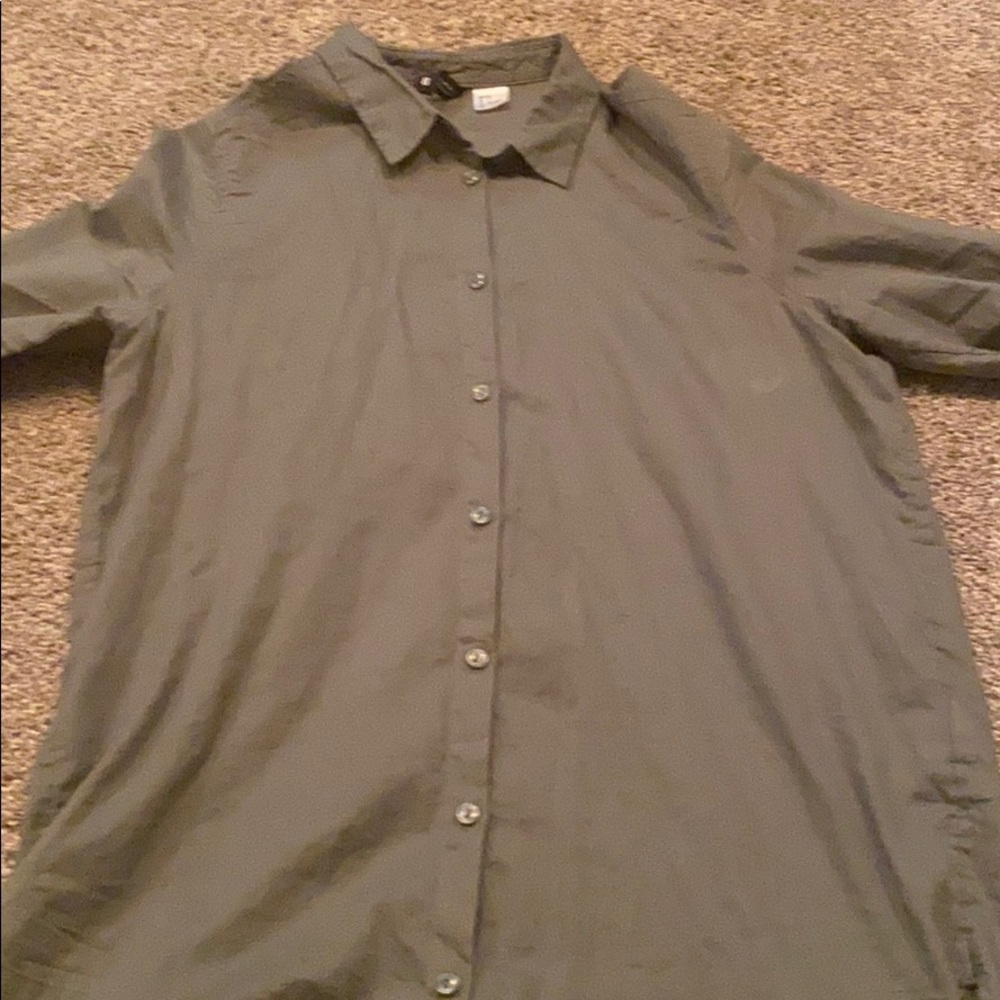 Dark green button up shirt.
